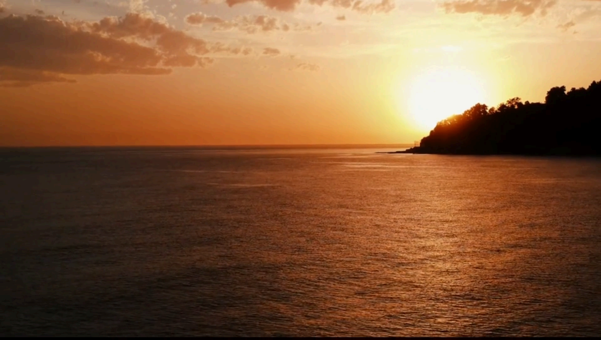 Sunset over calm ocean water