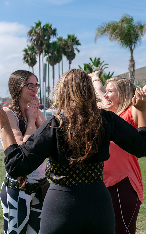 Women connecting during an outdoor Pause Breathwork session
