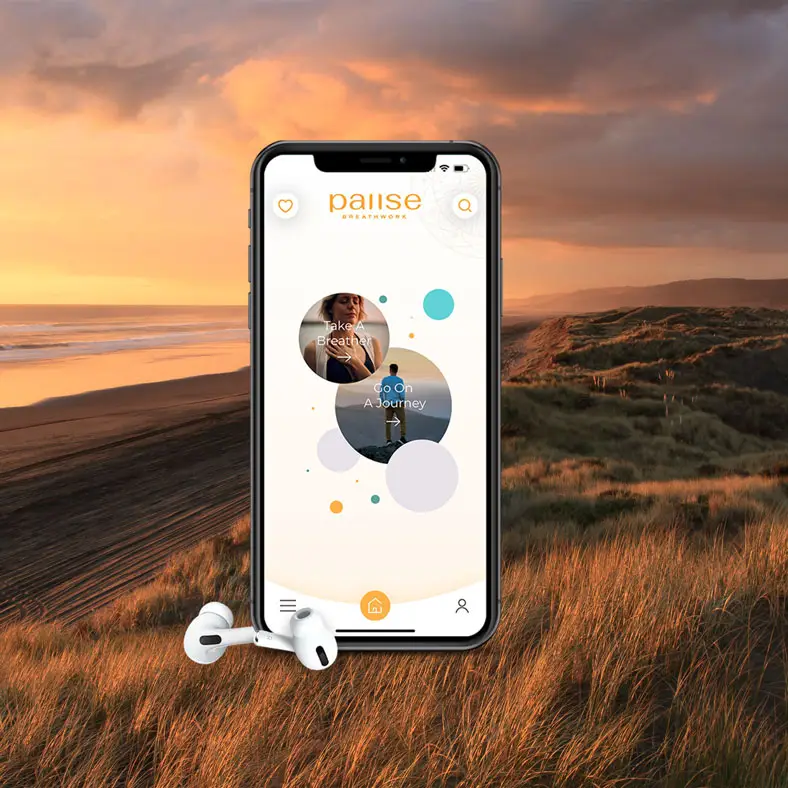 The Pause Breathwork app on a phone at sunset